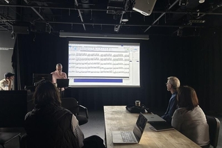 Suttor and FAS faculty listening to a musical piece inspired by nature, generated by AI, and edited by his Yale College students. Photo credit: Michaela Herrmann.